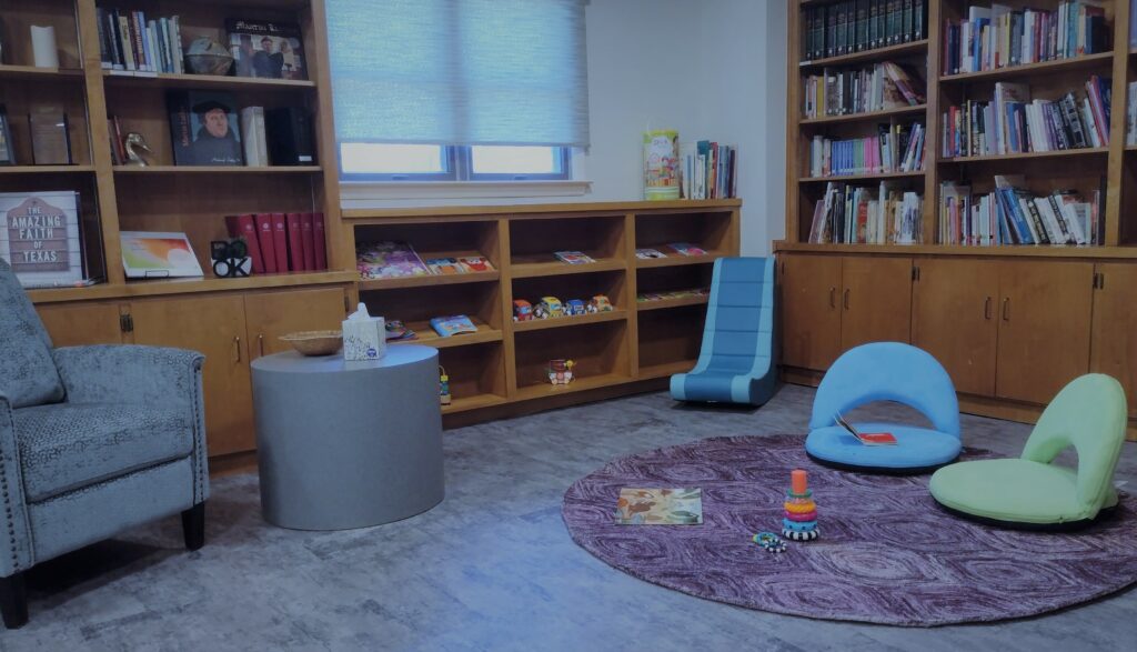 Shepherd of the Hills Family Room with kids chairs, purple rug, soft toys, books,