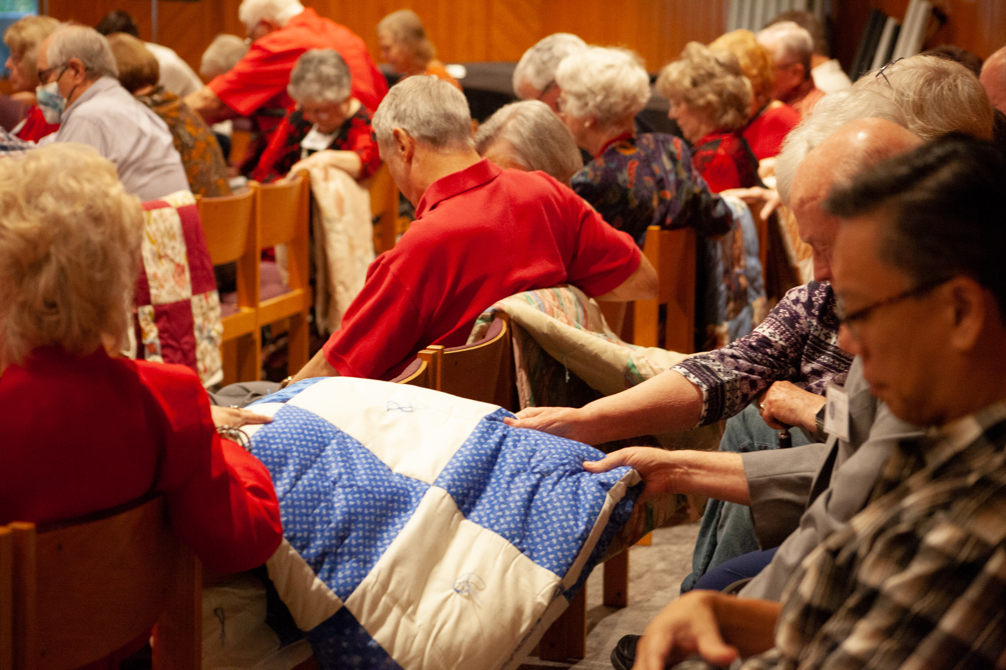 Blessing of LWR quilts in worship service