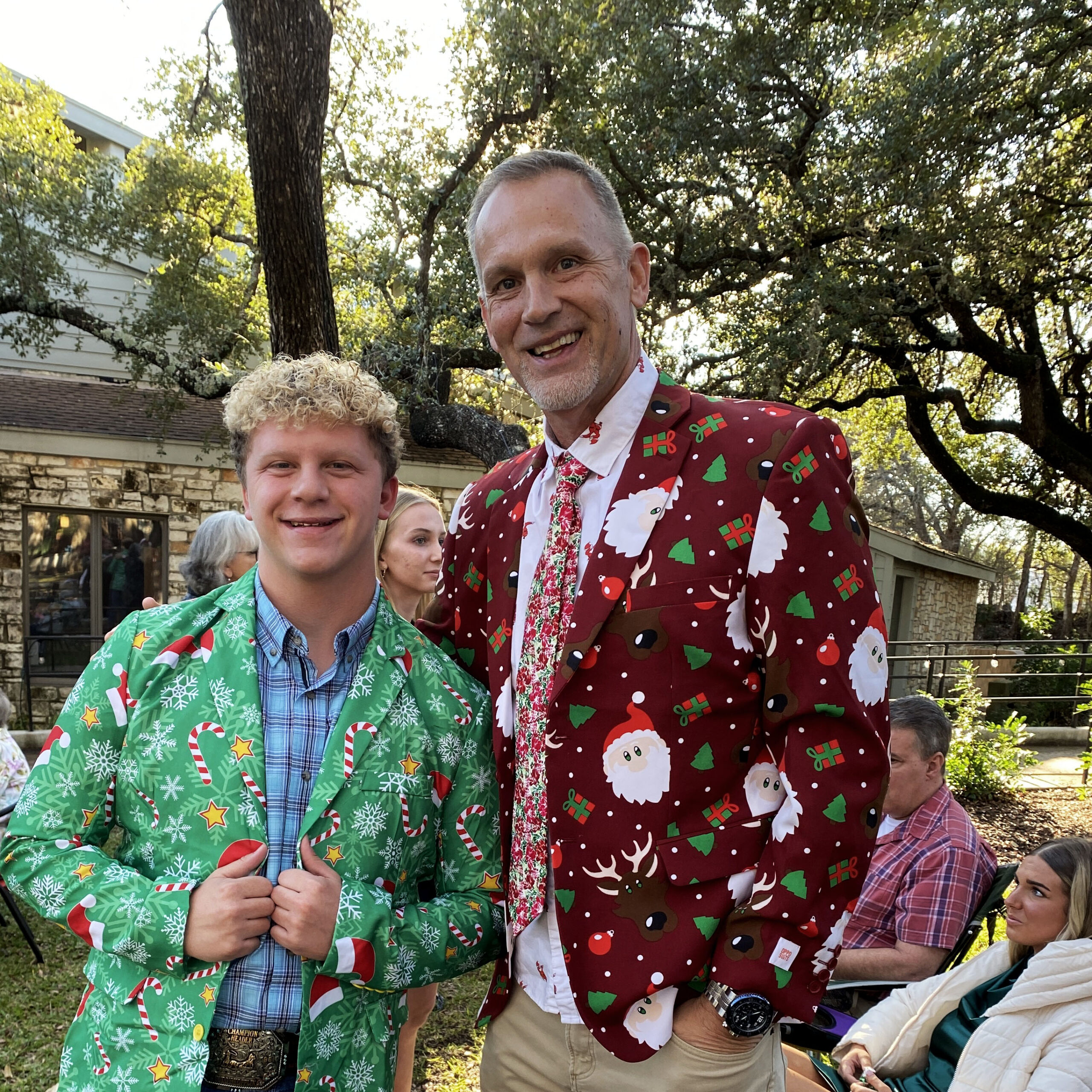 two men in funny christmas blazers